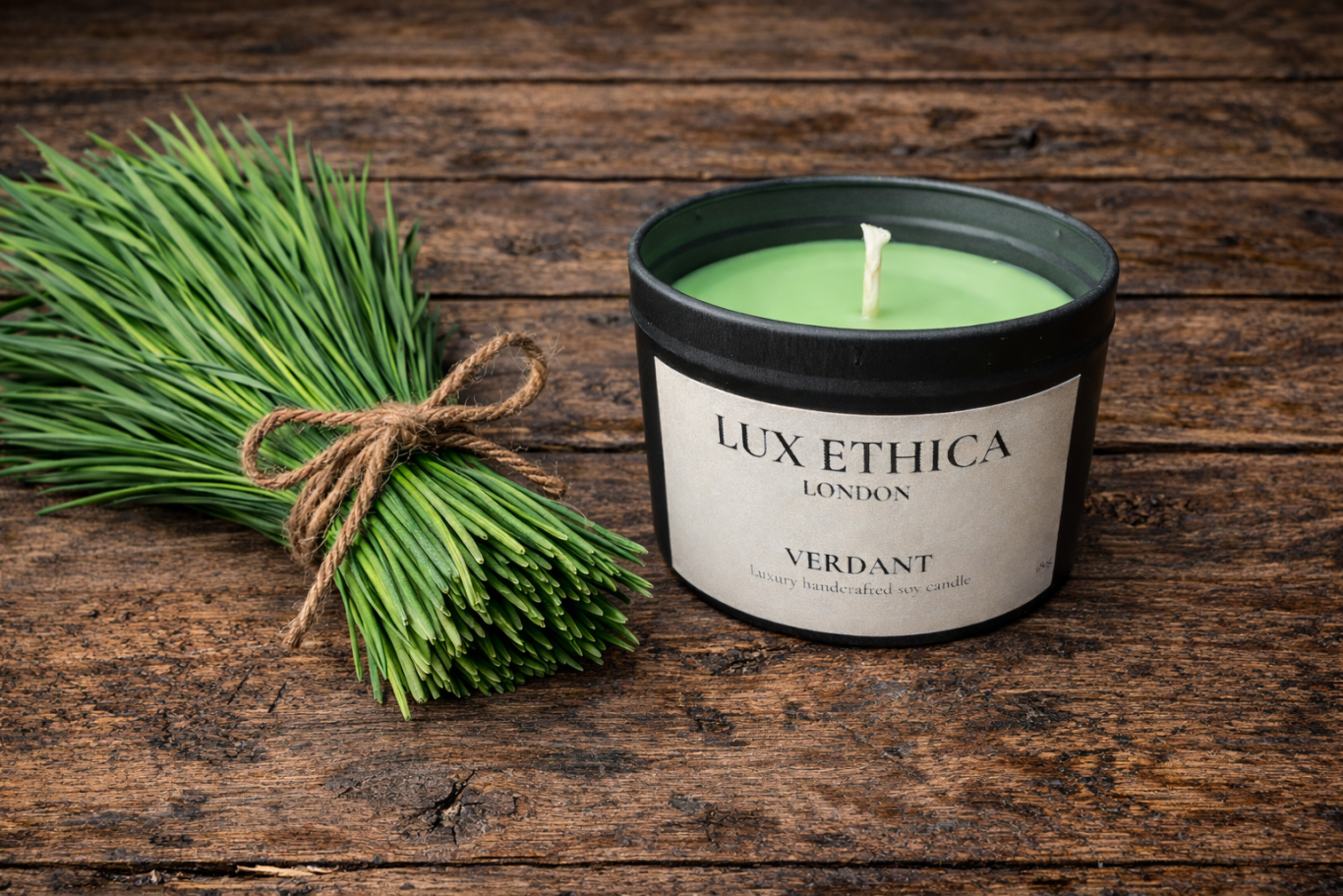 Verdant - Medium Green candle next to tied chives on a wooden surface.