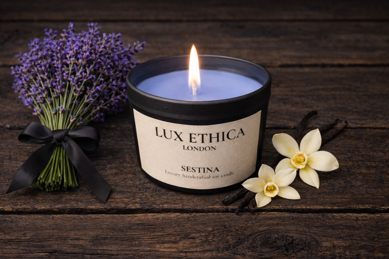 Sestina - Medium A lit candle beside lavender and white flowers on a rustic wooden surface.